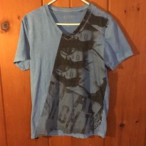 Guess blue t-shirt w/ unique design.